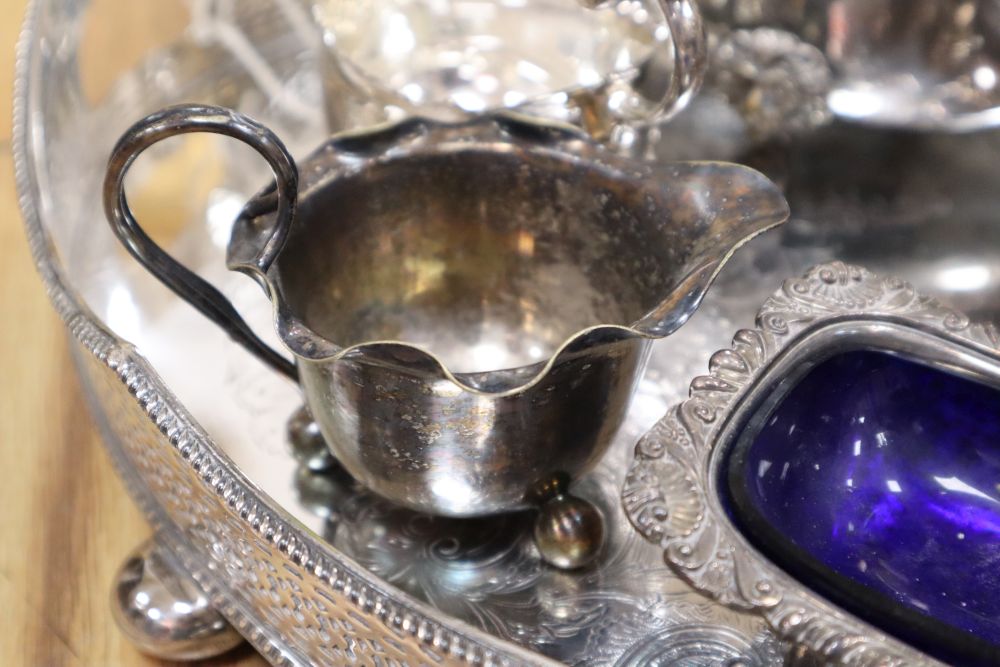 A large oval plated galleried tray and a collection of plated items,